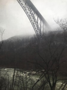 New River Gorge Bridge stretches into early morning fog
