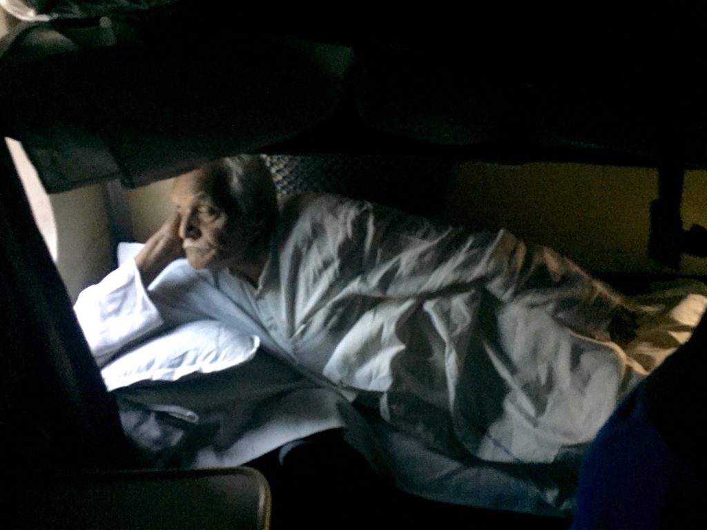 Passenger in sleeper car on train to Allahabad, India