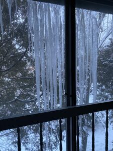 Icicles on window duirng Polar Vortex in Chciago